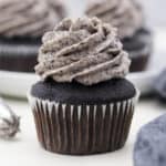 closeup of a chocolate cupcake frosted with Oreo buttercream