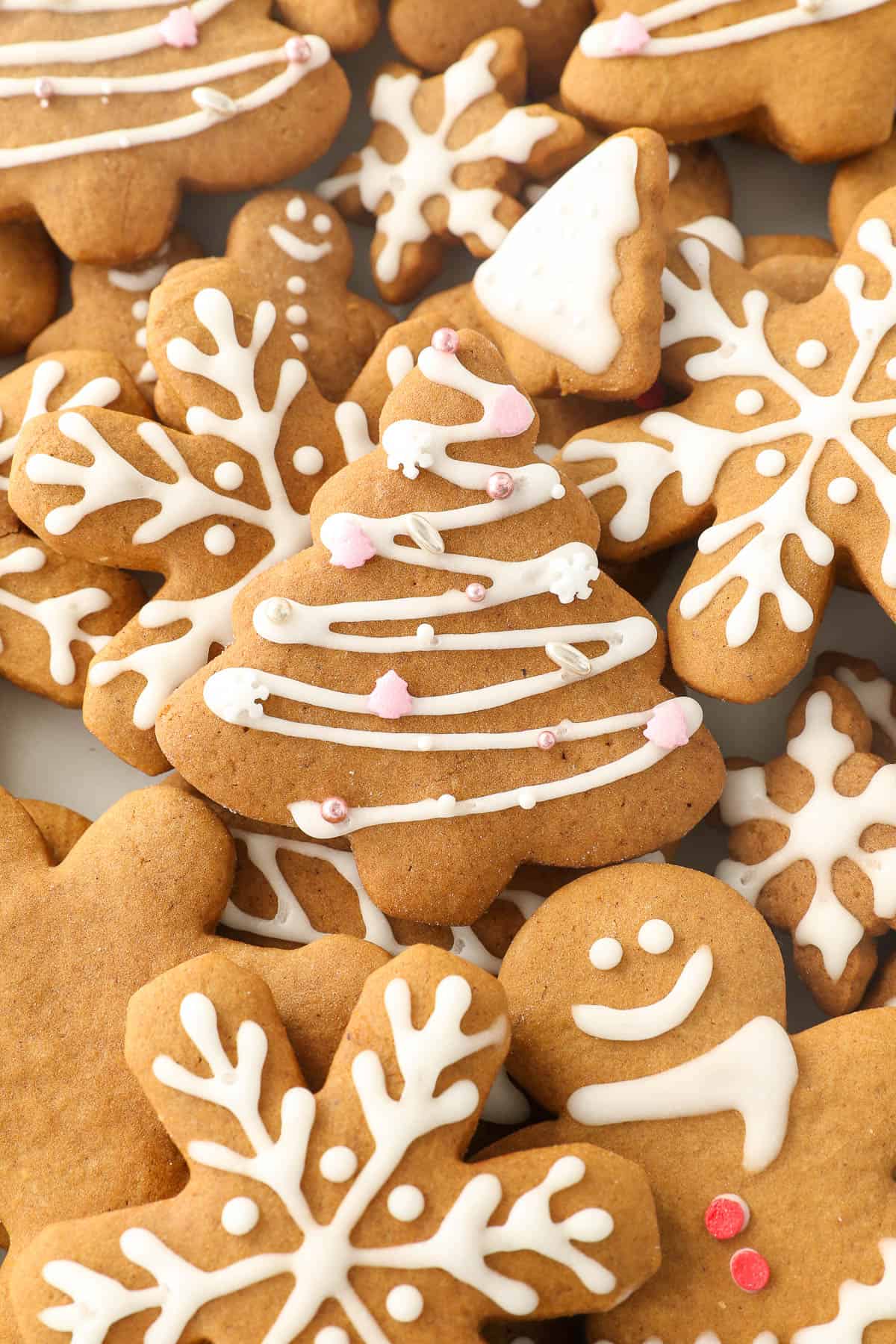 Gingerbread cookies cutout like Christmas trees and snowflakes