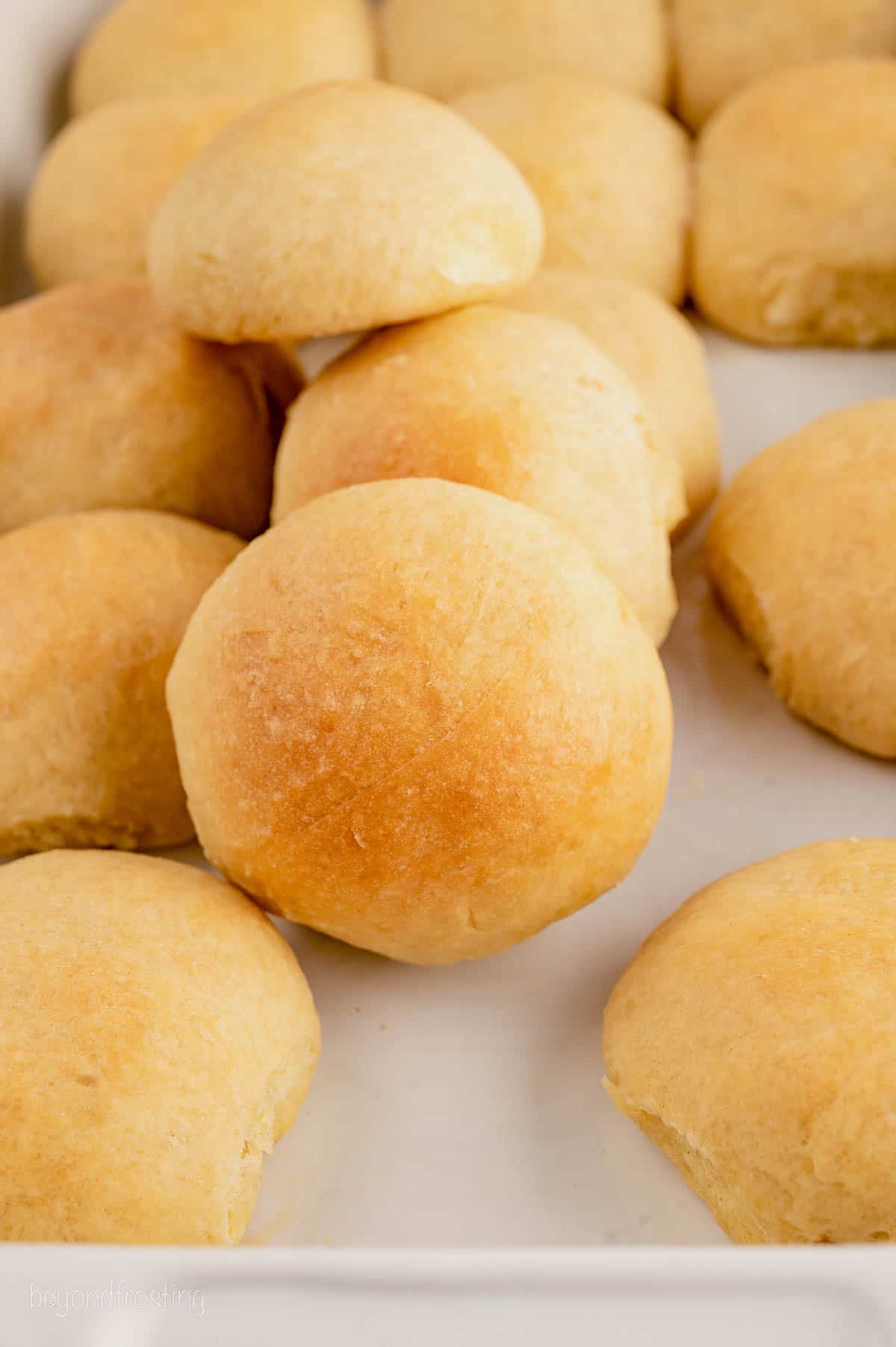 Assorted quick dinner rolls in a ceramic baking dish.