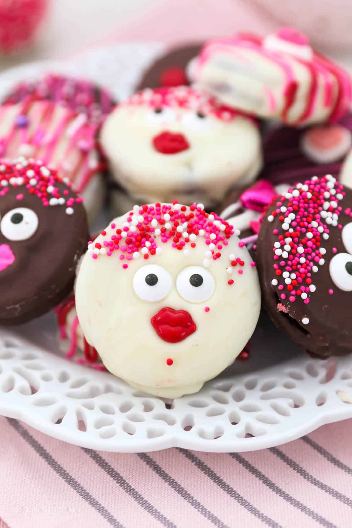 Oreos decorated with sprinkles, googly eyes and sprinkles for Valentine's Day