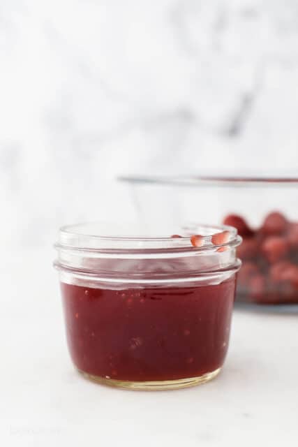 a small glass jar with cherry juice.
