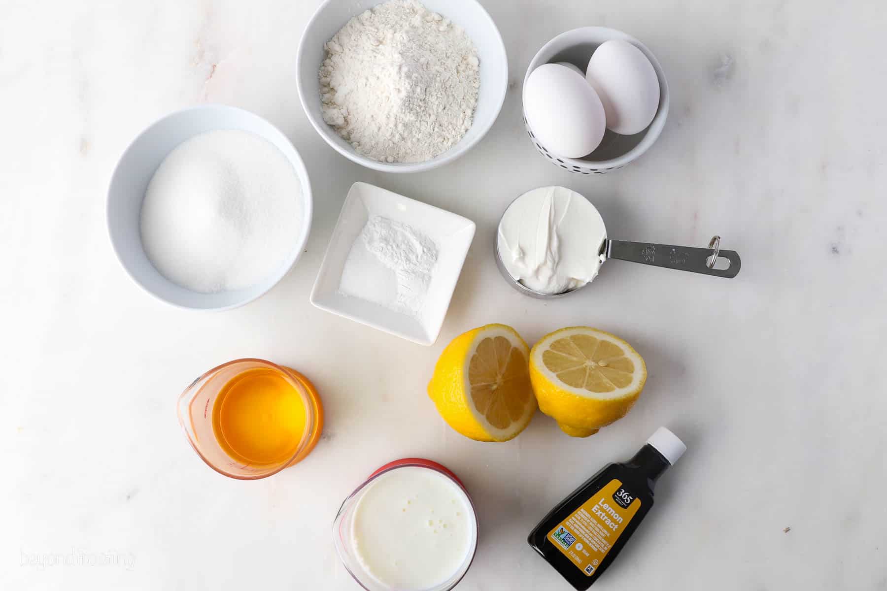 Ingredients for Lemon Cupcakes portions out in bowls and dishes