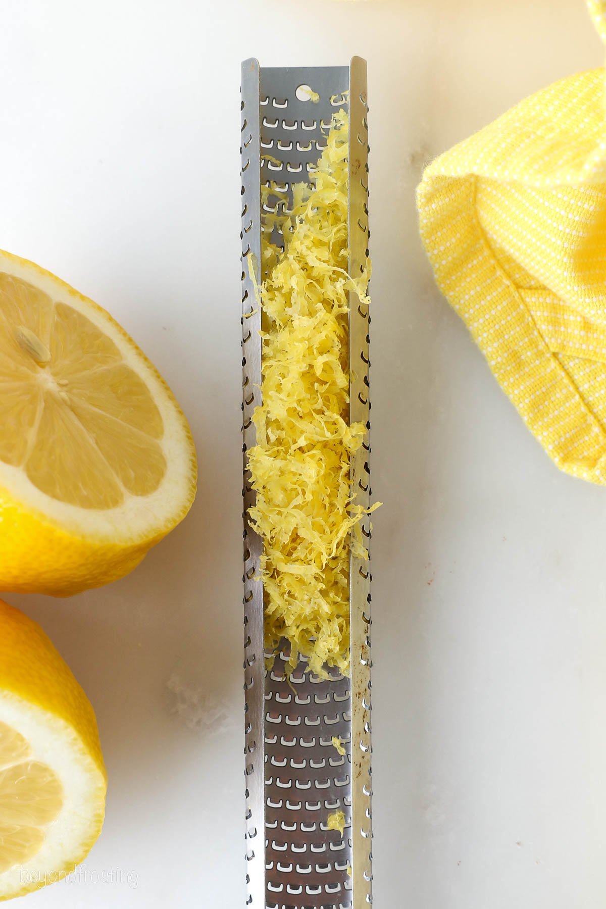 Lemon zested into a microplane zester