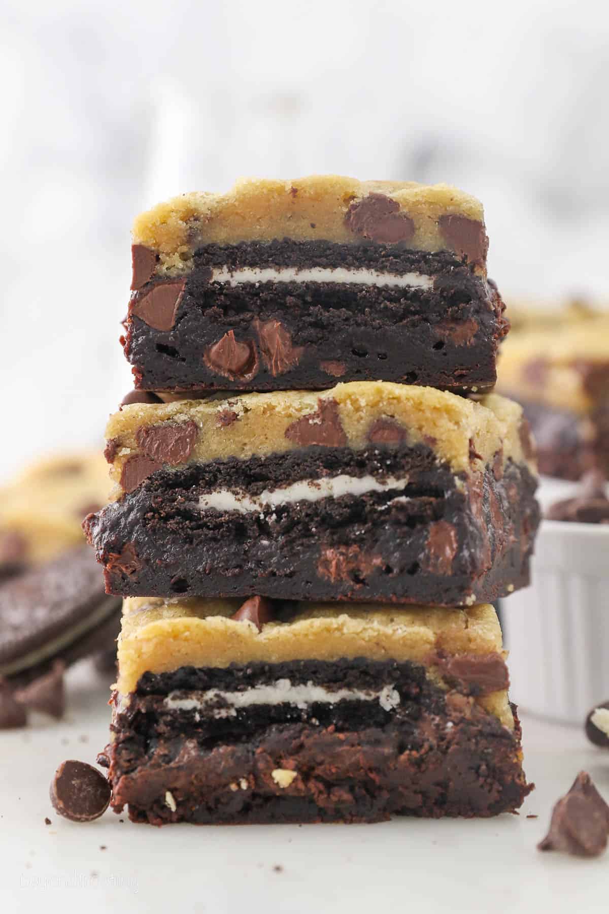 Three slutty brownies stacked on top of one another.