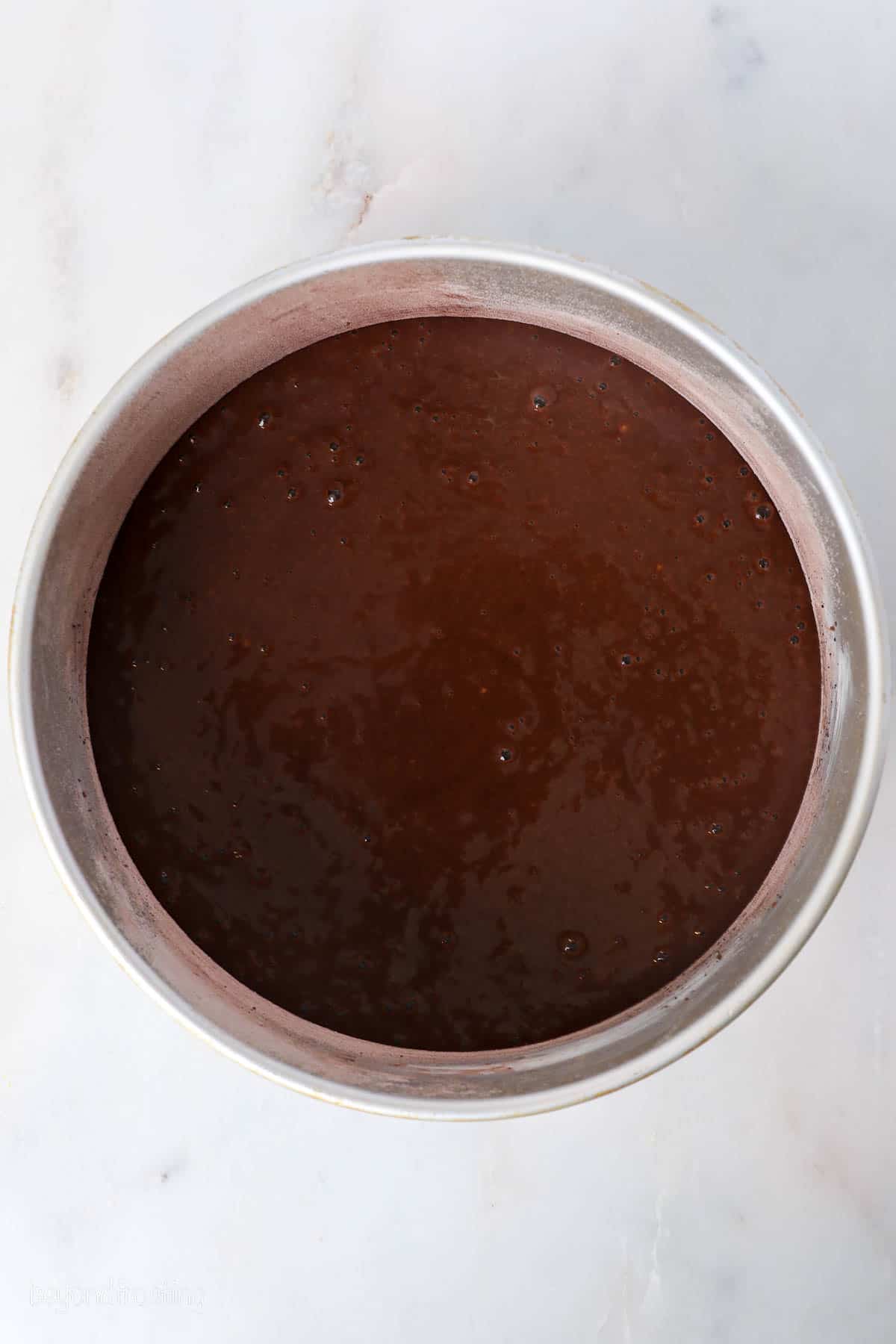 This chocolate mousse cake recipe is easy to make, with layers of moist chocolate cake, fluffy chocolate mousse, and creamy chocolate ganache. Chocolate cake batter in an 8-inch round cake pan.