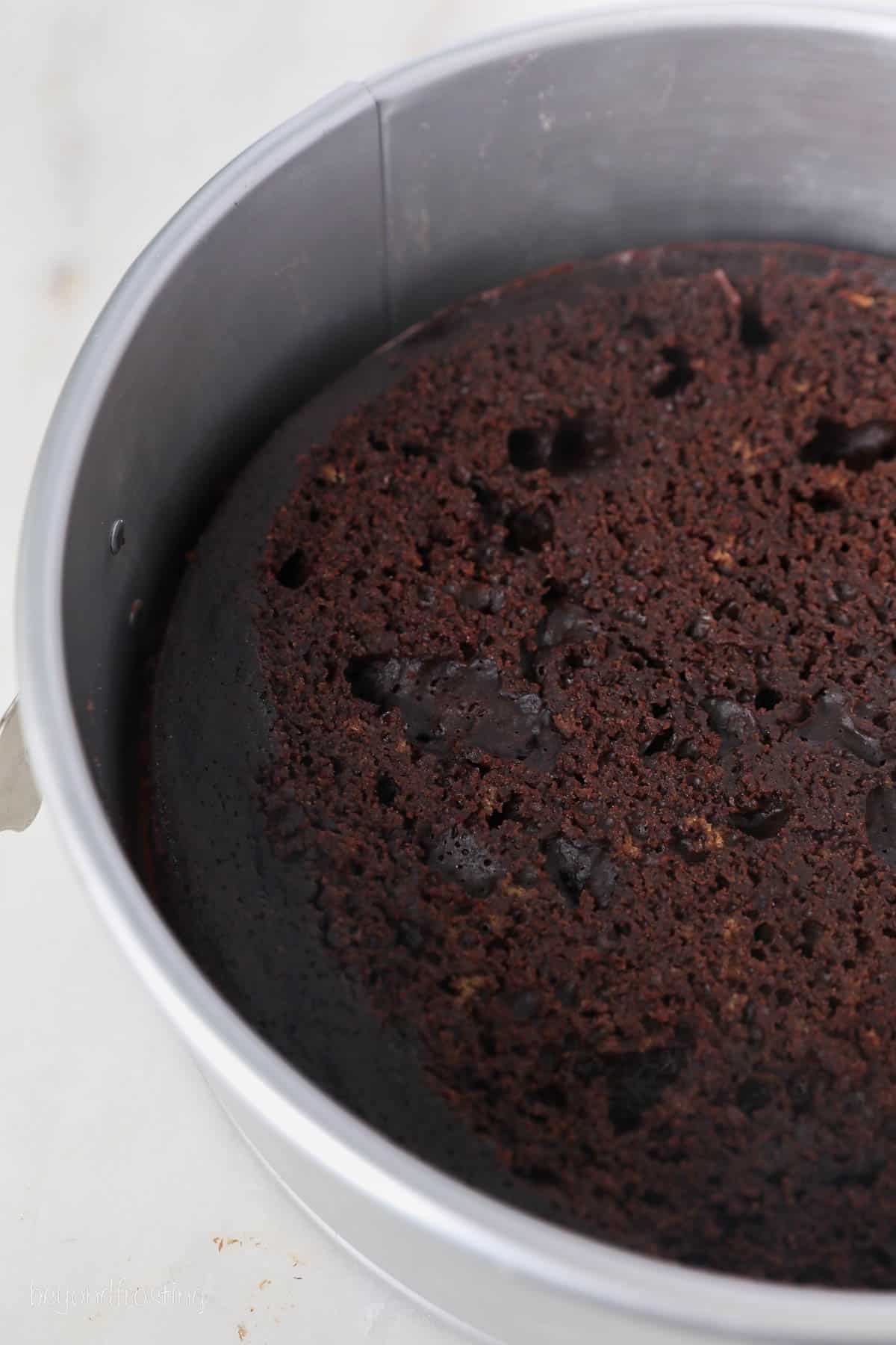 This chocolate mousse cake recipe is easy to make, with layers of moist chocolate cake, fluffy chocolate mousse, and creamy chocolate ganache. Baked chocolate cake in a springform pan.