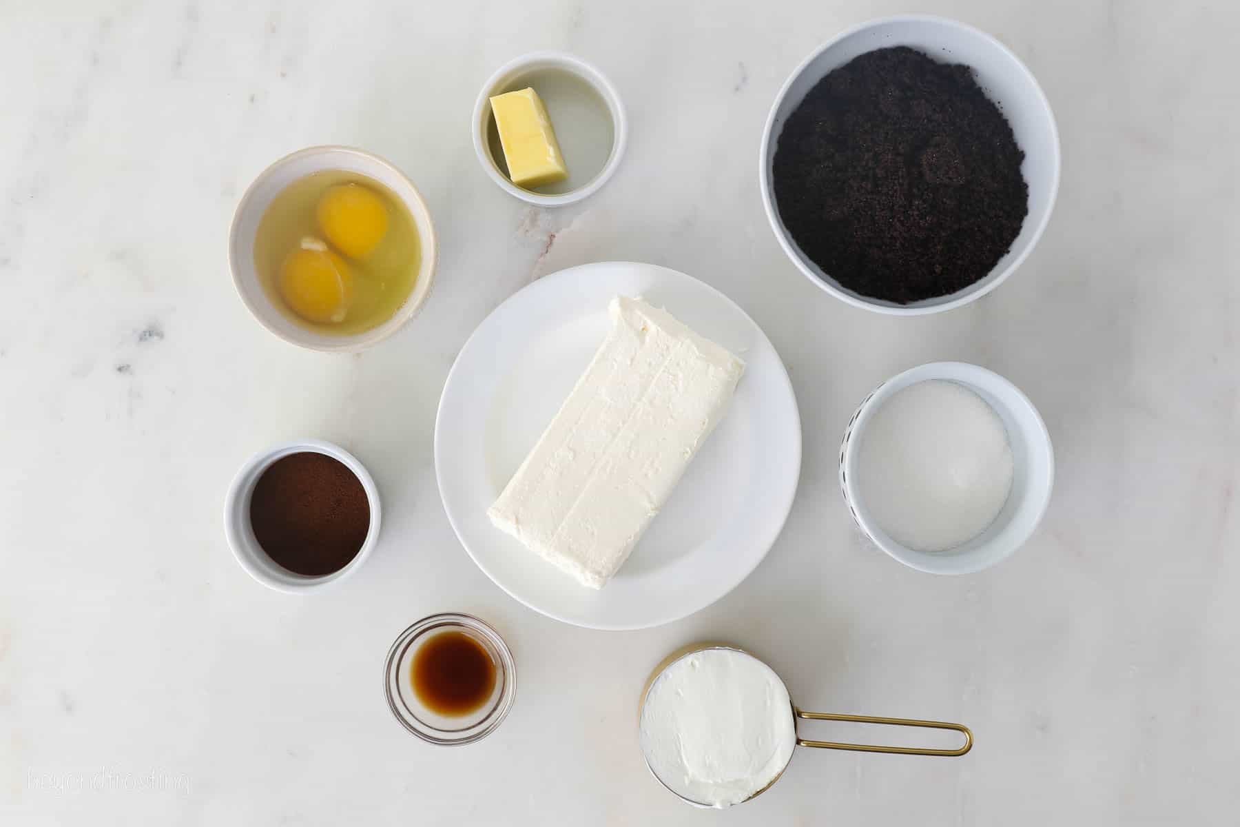 Ingredients for mini coffee cheesecakes laid out in bowls