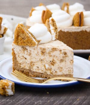 side view of a slice of oatmeal cream pie ice cream pie on a plate with a gold fork.