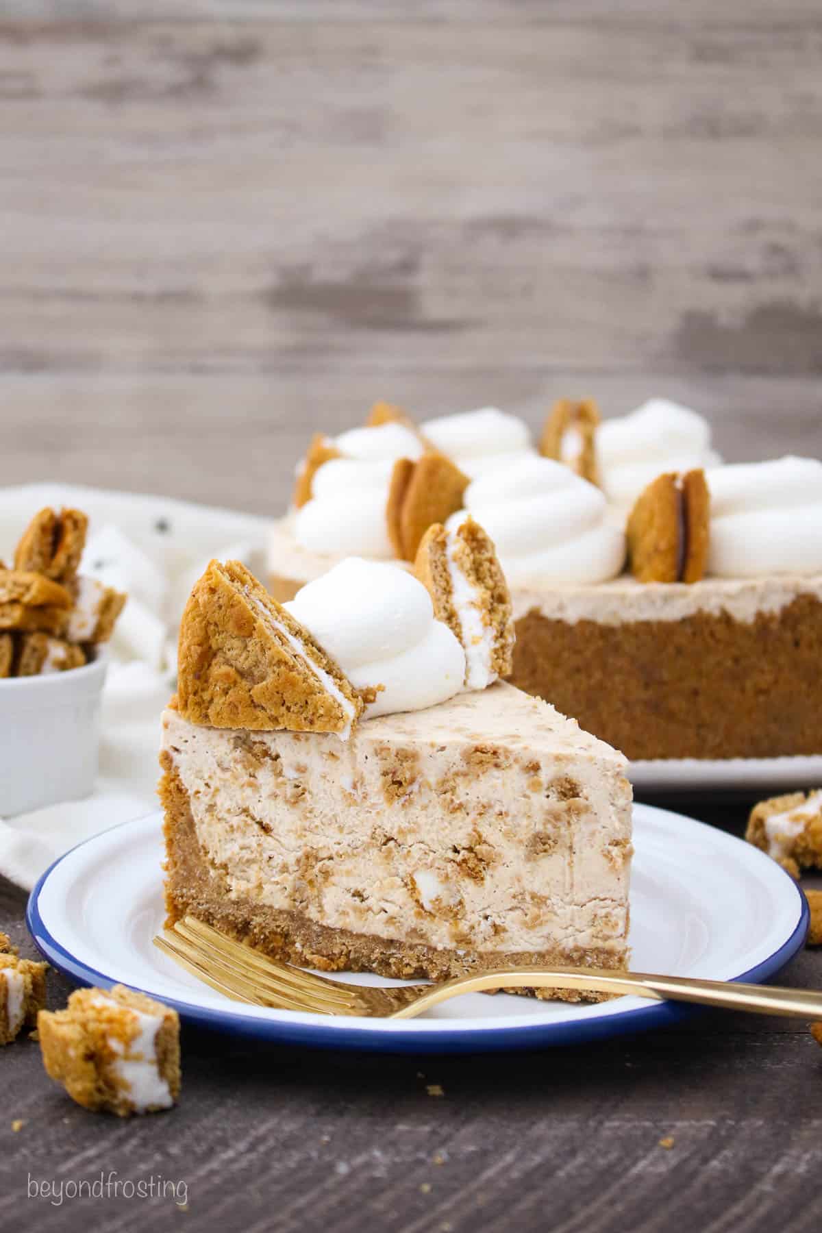 side view of a slice of oatmeal cream pie ice cream pie on a plate with a gold fork.