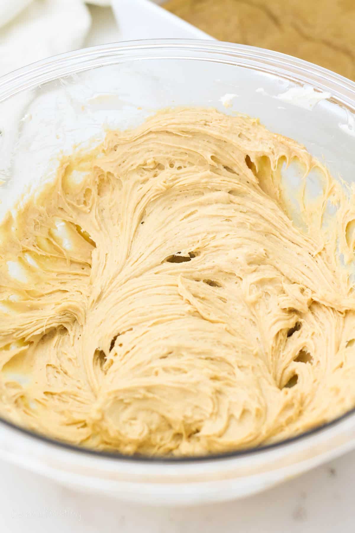 overhead of a bowl of peanut butter cheesecake filling.