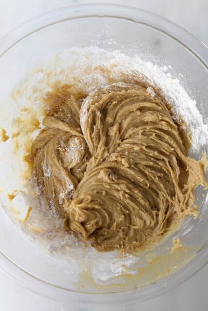 A mixing bowl with batter for blondie bars