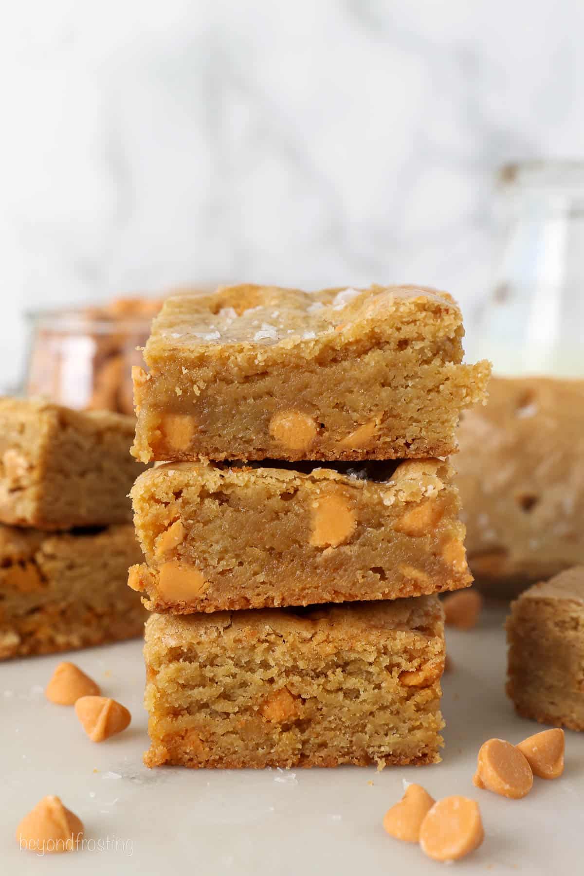 A stack of three blondies with butterscotch chips and sea salt