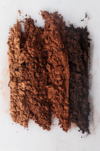Four different types of cocoa powder spread into rows for comparison.