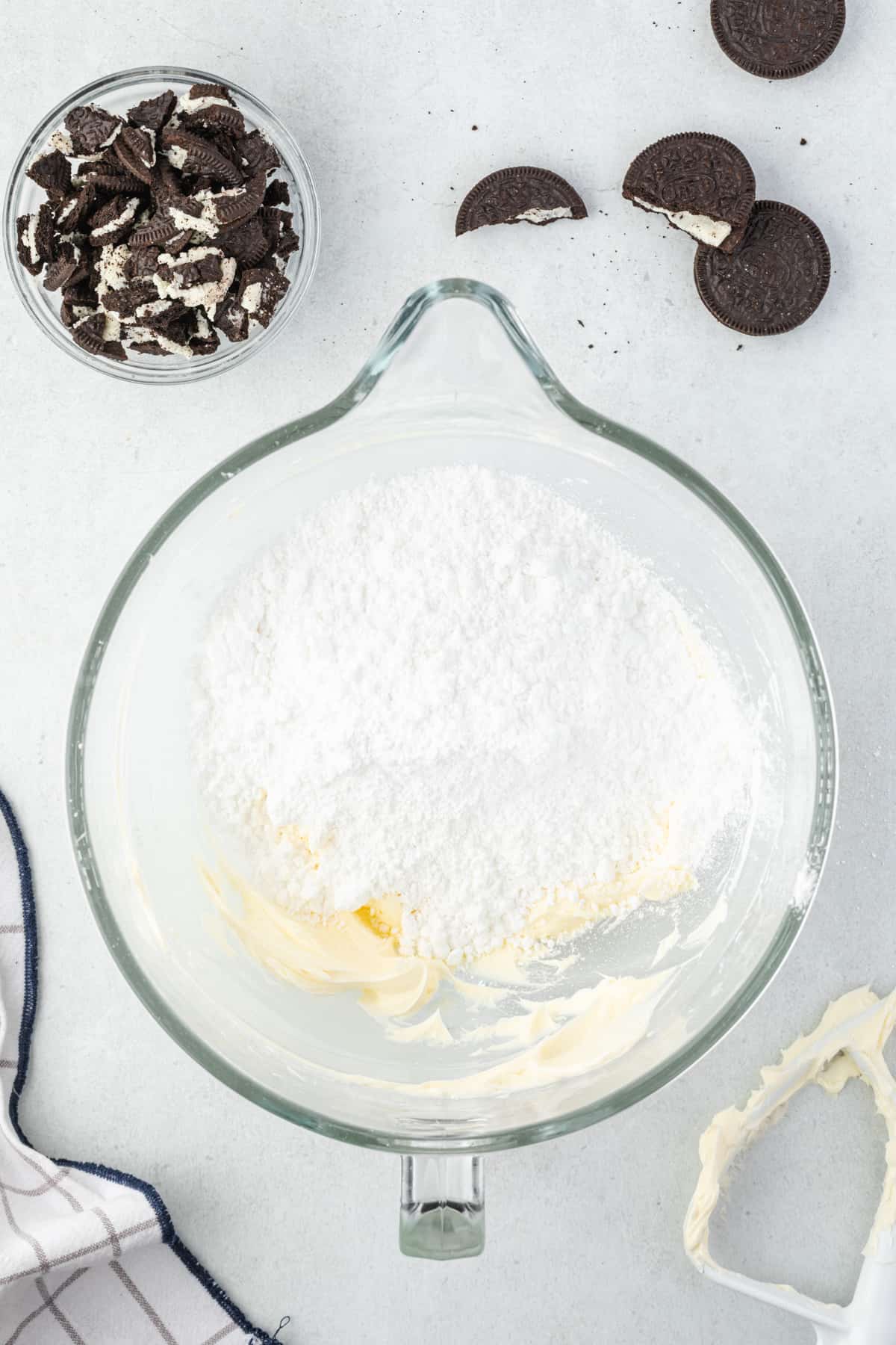 creamed butter and powdered sugar in a glass mixing bowl