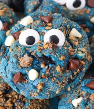 Close up of a Cookie Monster cookies topped with candy eyes.