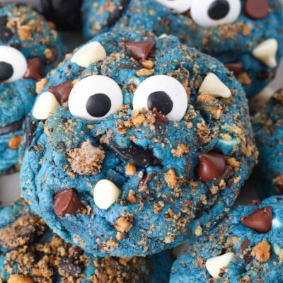 Close up of a Cookie Monster cookies topped with candy eyes.