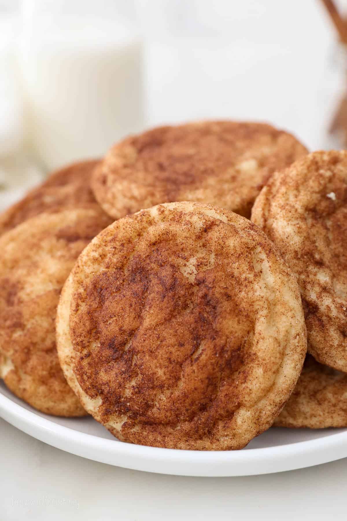 Close up of snickerdoodle cookies on a white plate.