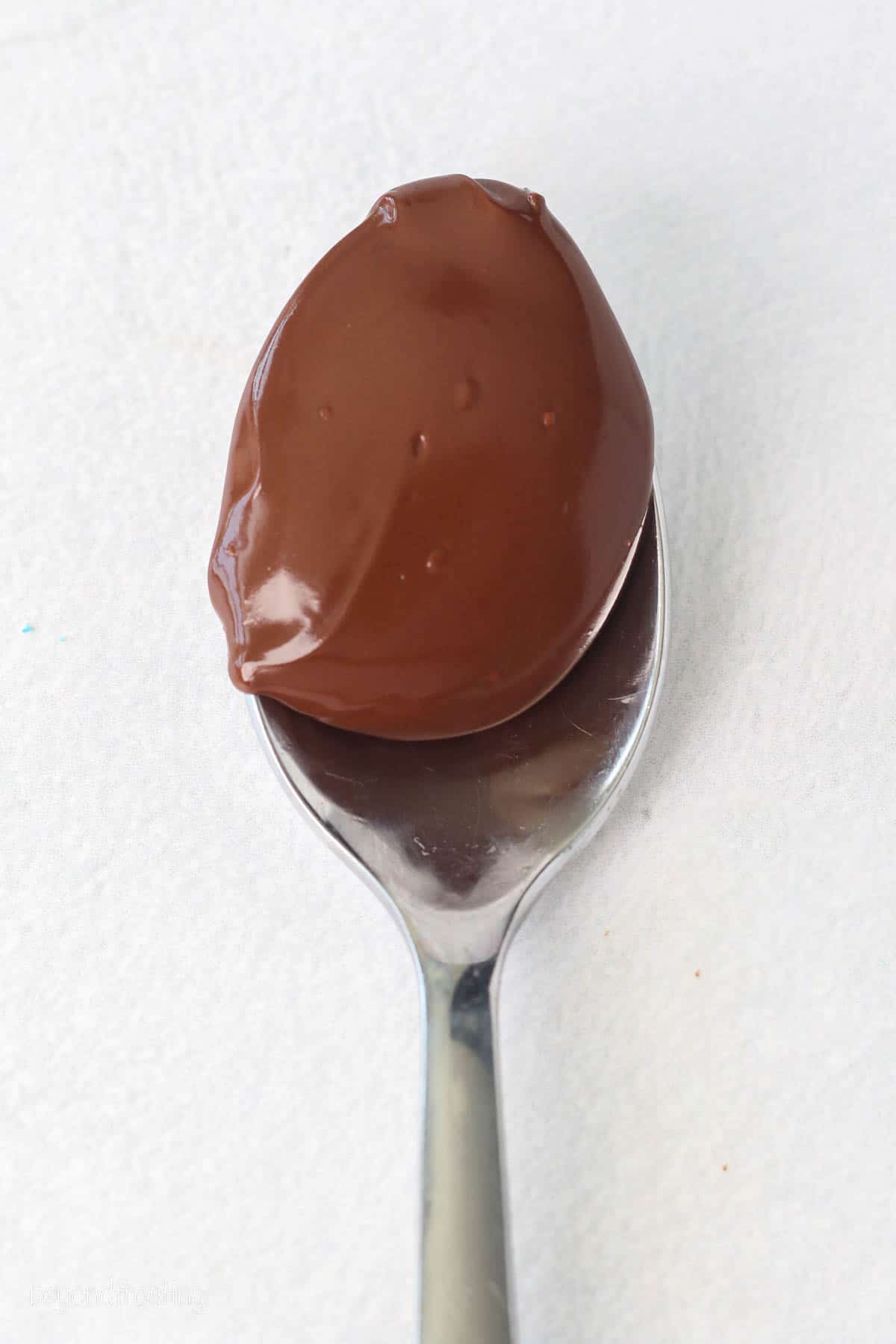 A spoonful of melted chocolate.