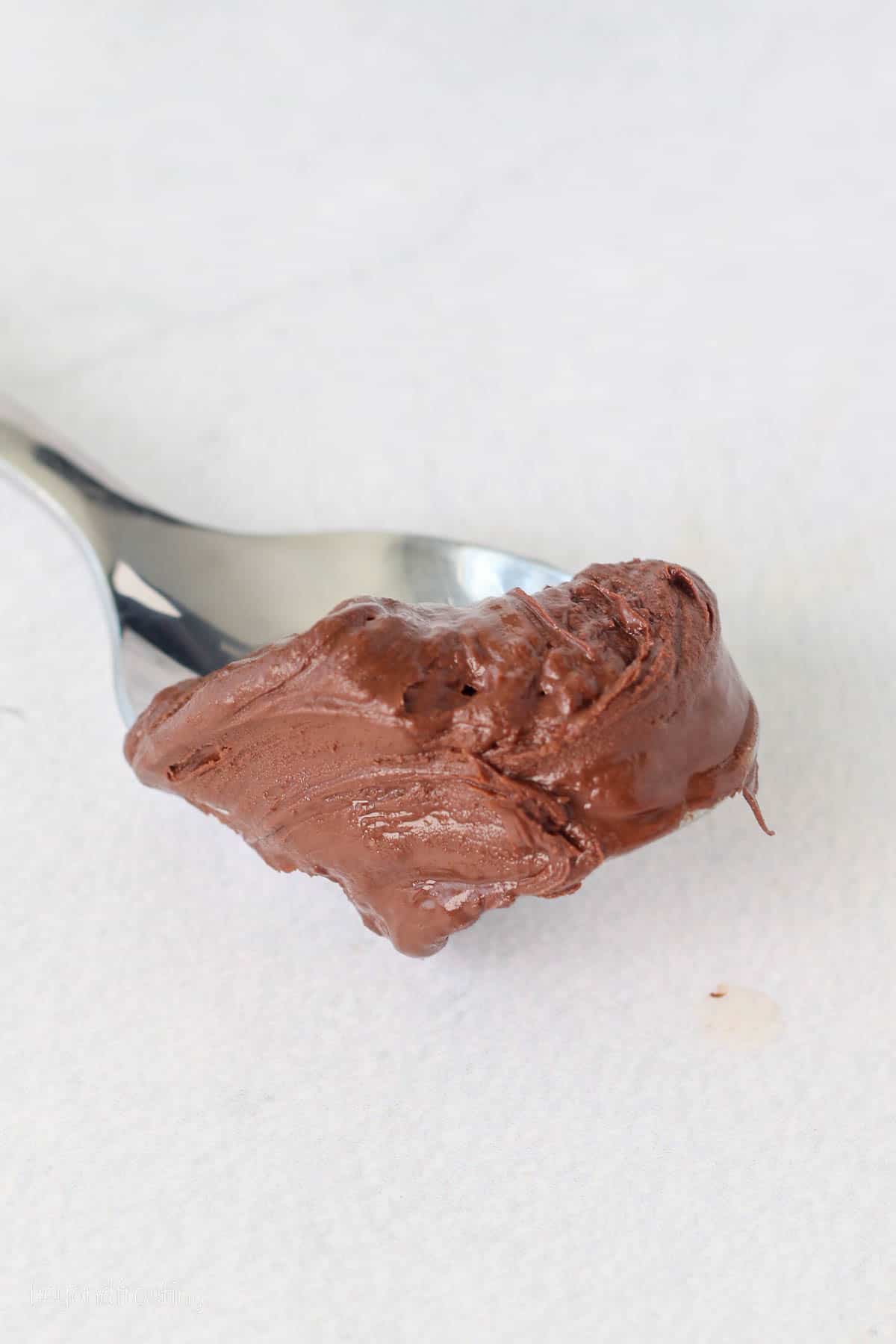 A spoonful of melted chocolate.