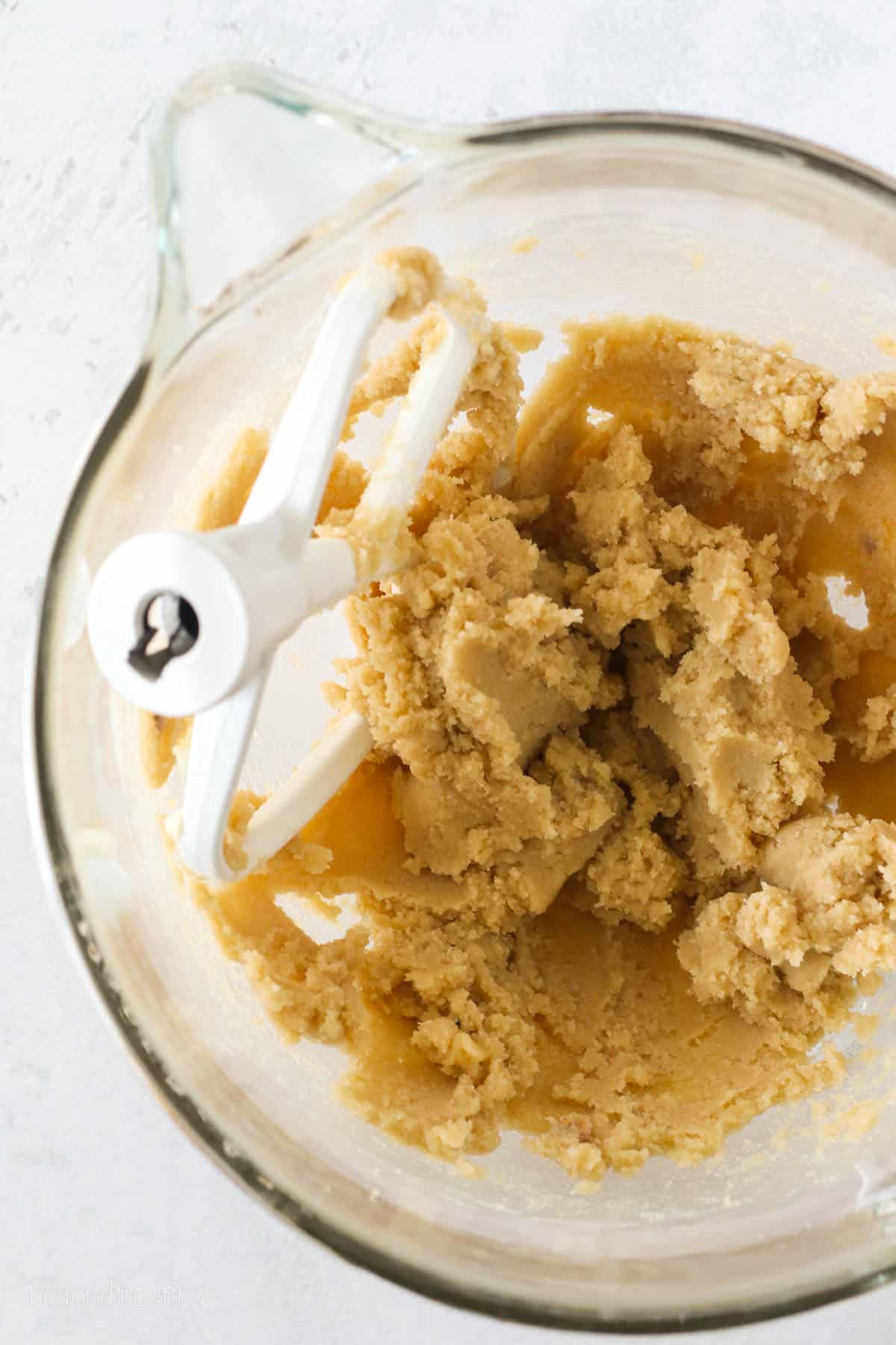 Cookie dough ingredients combined in a mixing bowl.