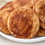 Close up of snickerdoodle cookies on a white plate.