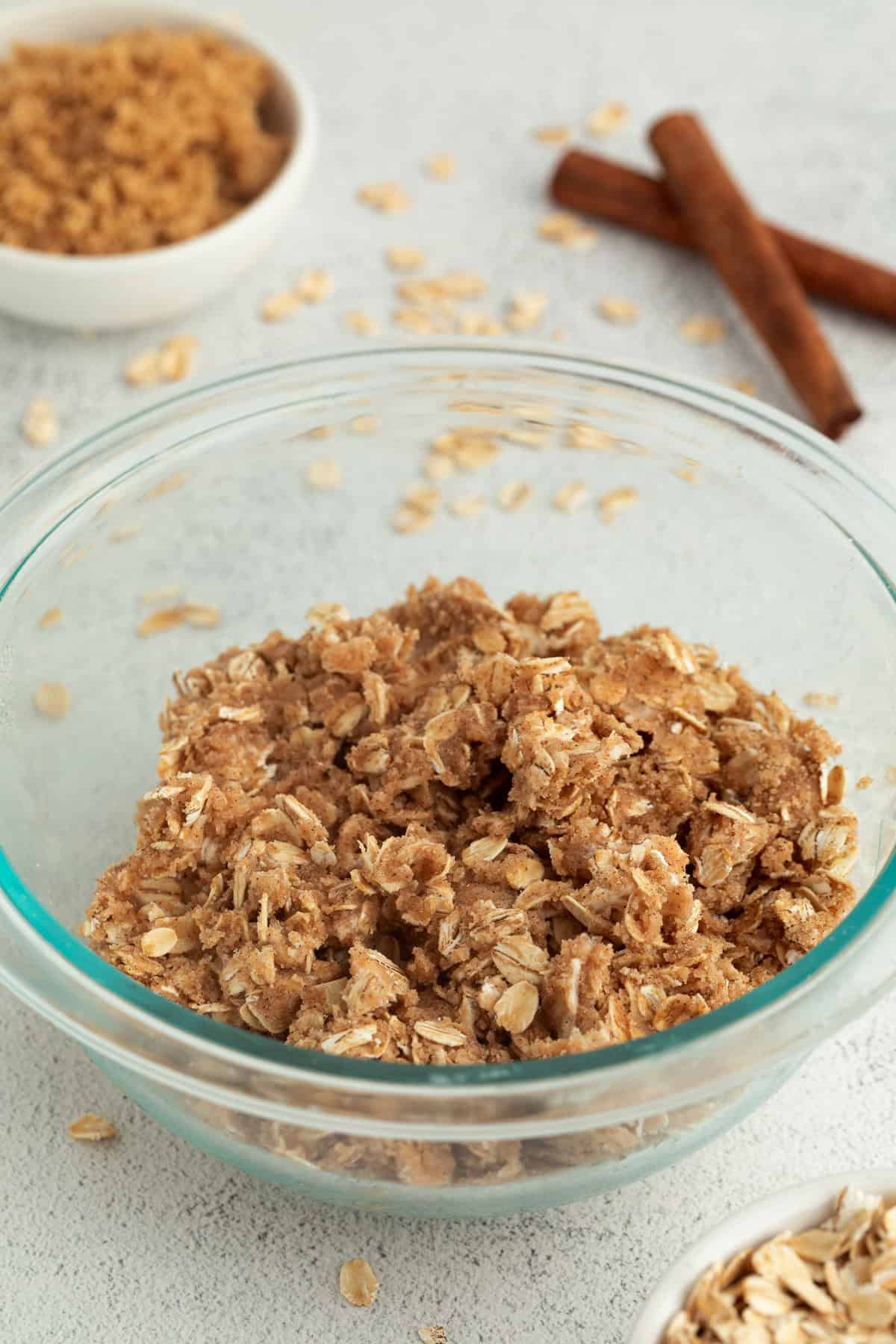 Oat crumble topping in a glass bowl.