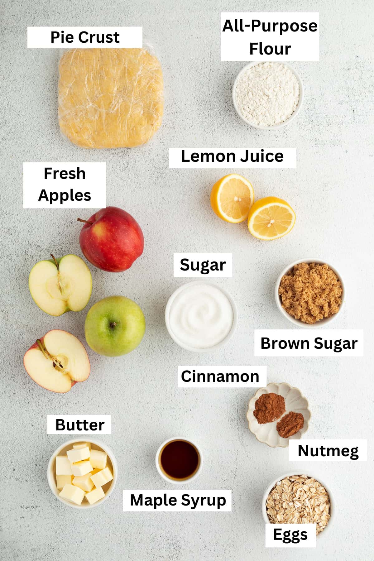 Apple crumble pie ingredients with text labels overlaying each ingredient.