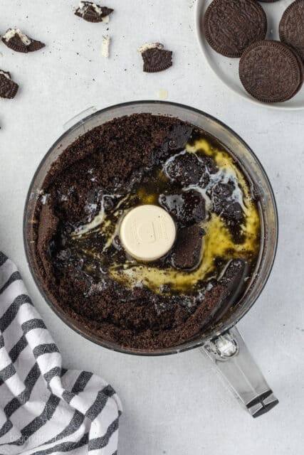 melted butter in a food processor with crushed Oreos