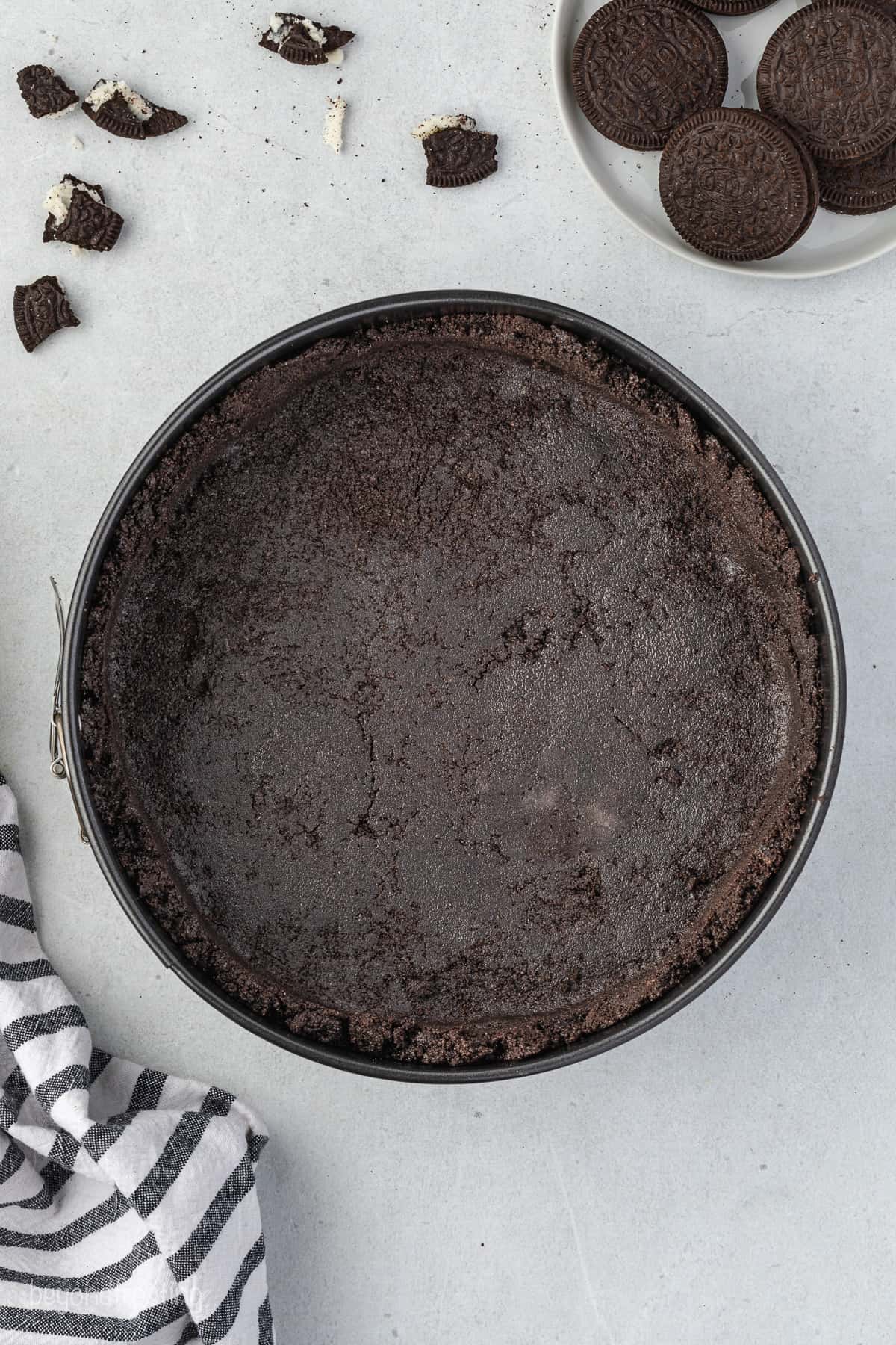 a springform pan with Oreo crust