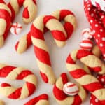 Assorted candy cane cookies on a white countertop.