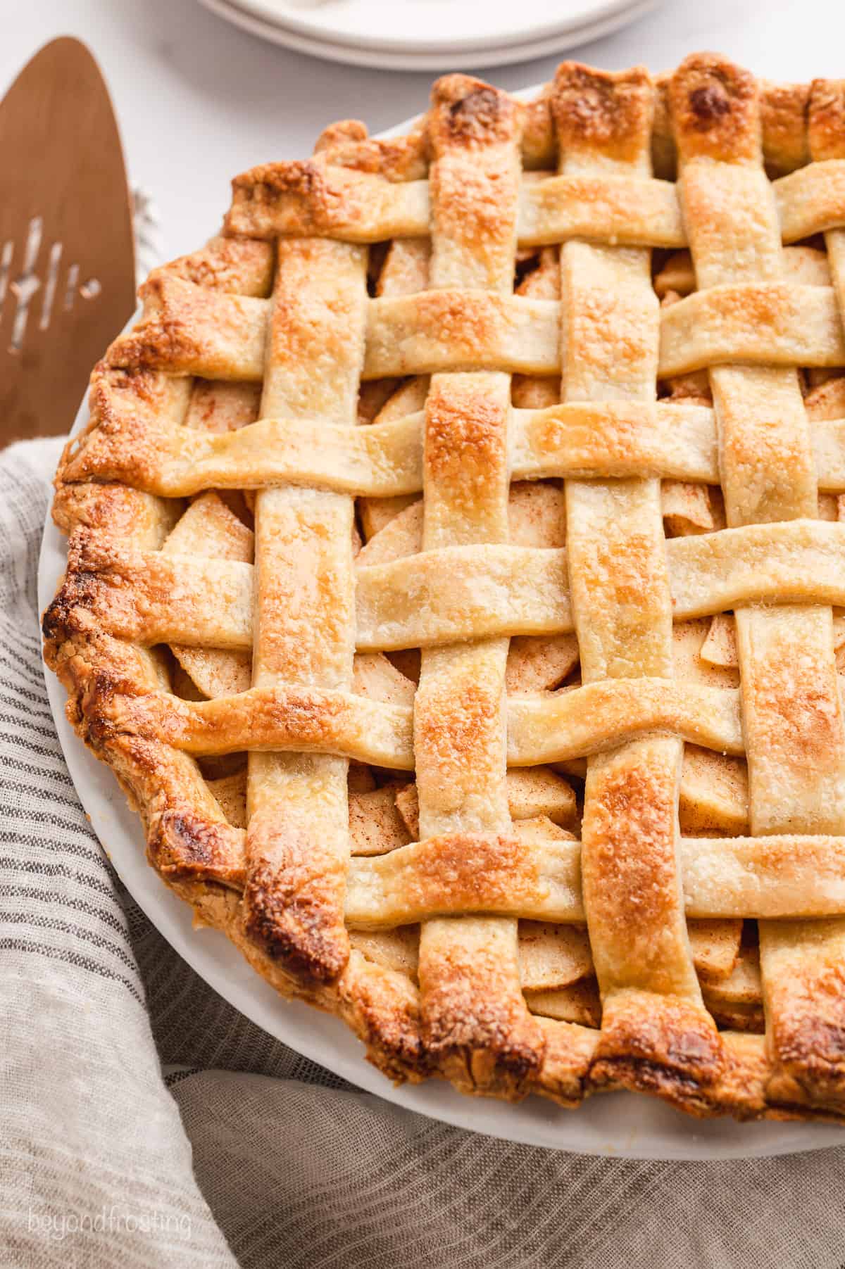 Close up of a baked pie with a lattice crust.