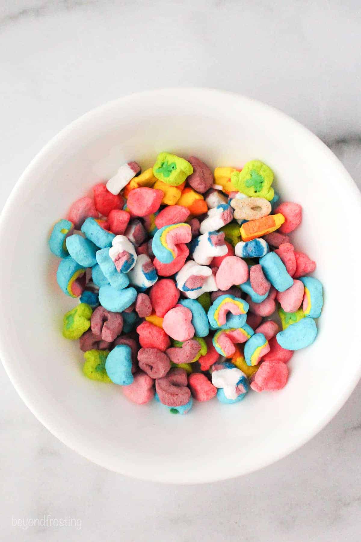 Lucky Charms marshmallows in a white bowl.
