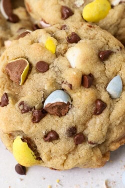 A close up of the top of a chocolate chip cookie with Cadbury Mini Eggs