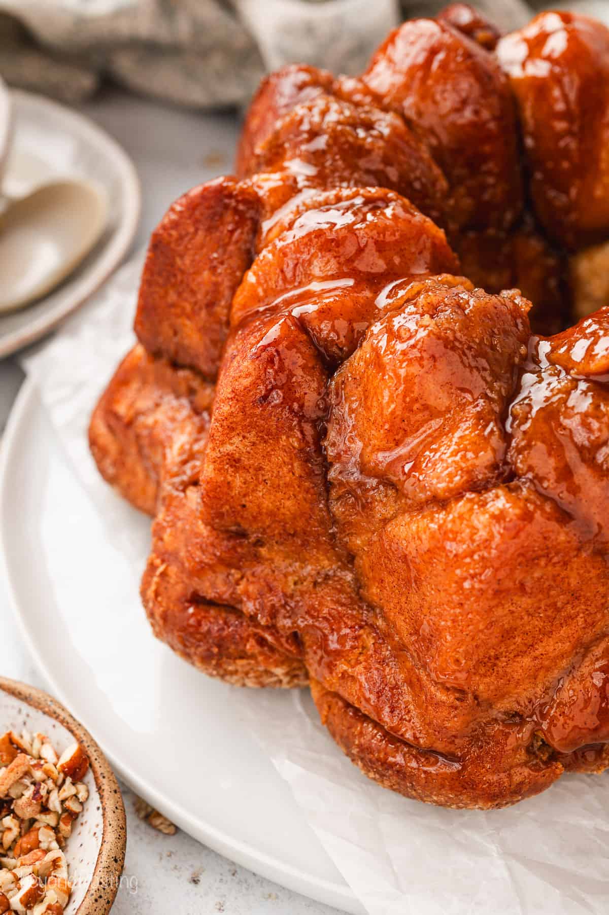Close up of baked monkey bread on a white plate.
