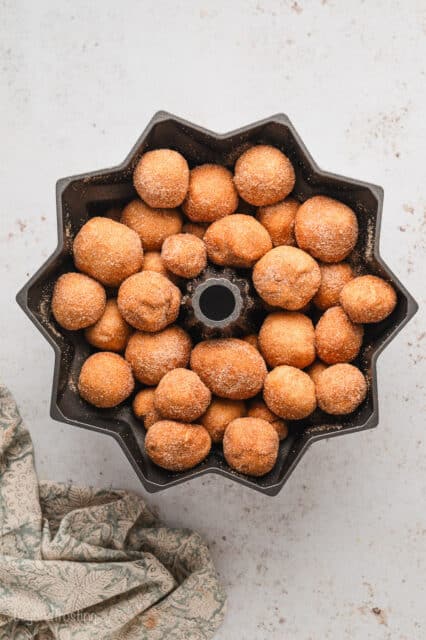 Dough balls assembled inside a bundt pan.