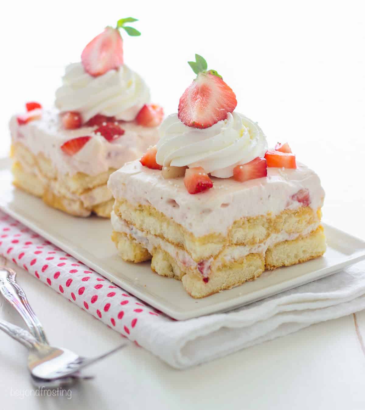 Two pieces of strawberry shortcake.