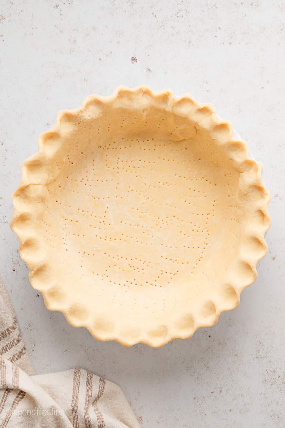 Pie crust pressed into a pie plate.