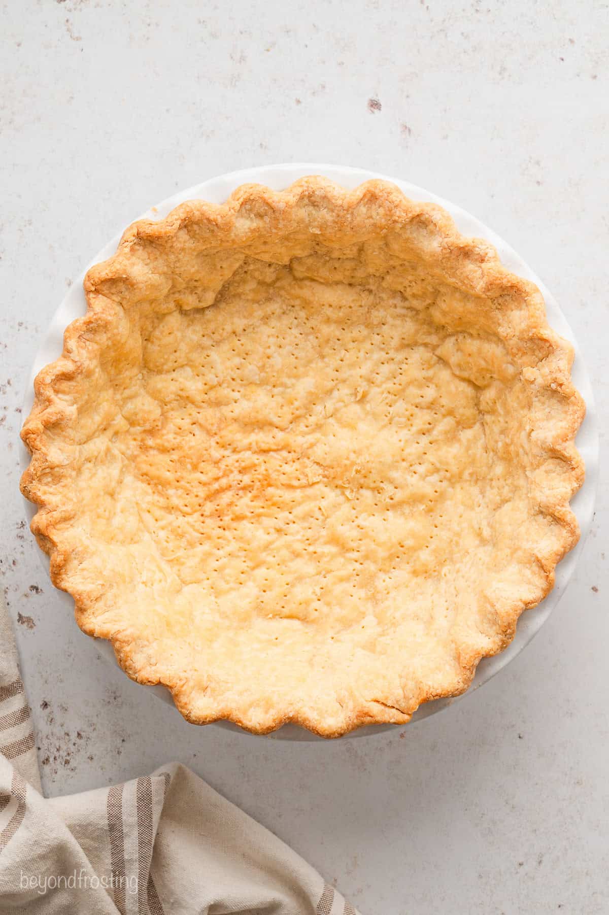Par-baked pie crust in a pie plate.
