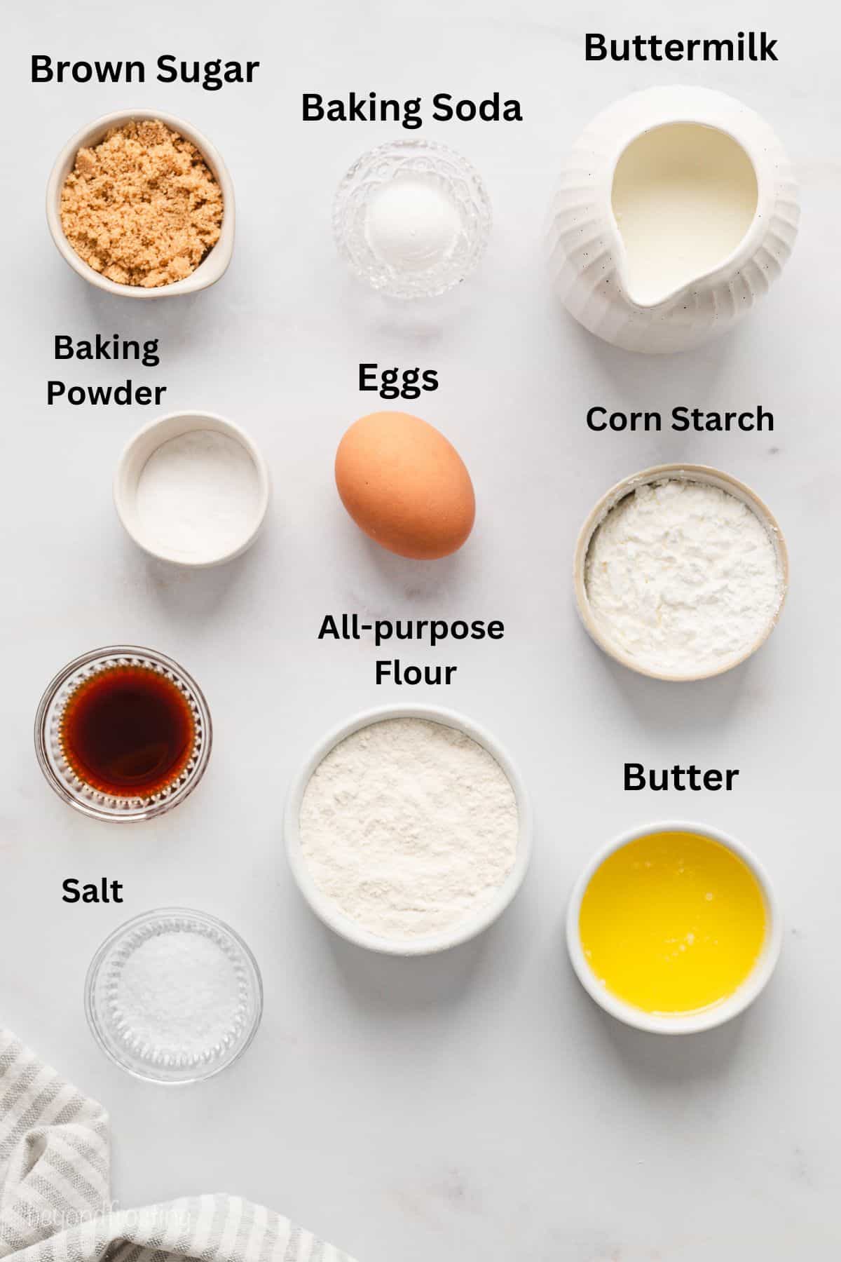 Ingredients for buttermilk waffles with text labels overlaying each ingredient.