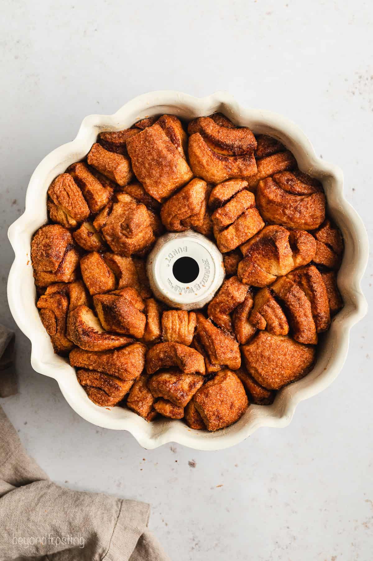 Overhead view of baked cinnamon roll monkey bread inside a bundt pan.