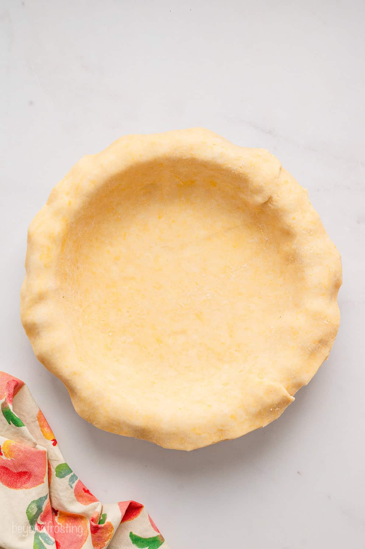 Pie crust rolled out into a pie plate.