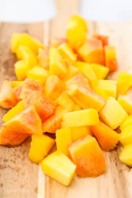 diced fresh peaches on a cutting board