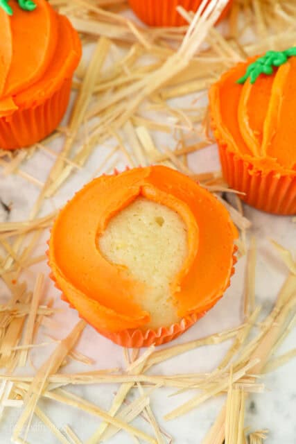 A process shot for decorating pumpkin themed cupcakes for Halloween