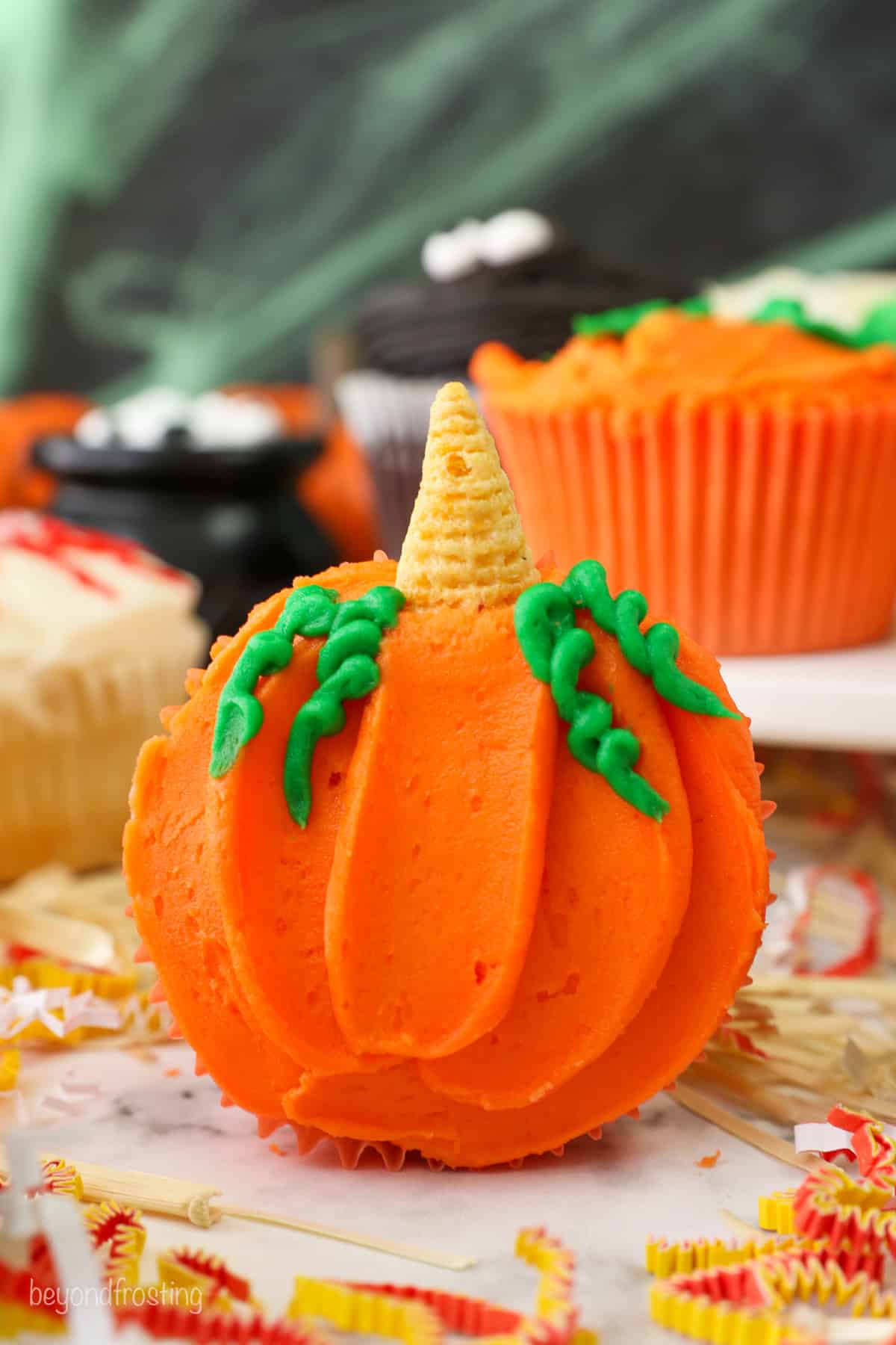 A decorated pumpkin patch themed cupcake for halloween