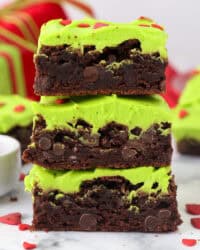 Side view of three Grinch brownies stacked on top of one another.