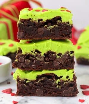 Side view of three Grinch brownies stacked on top of one another.