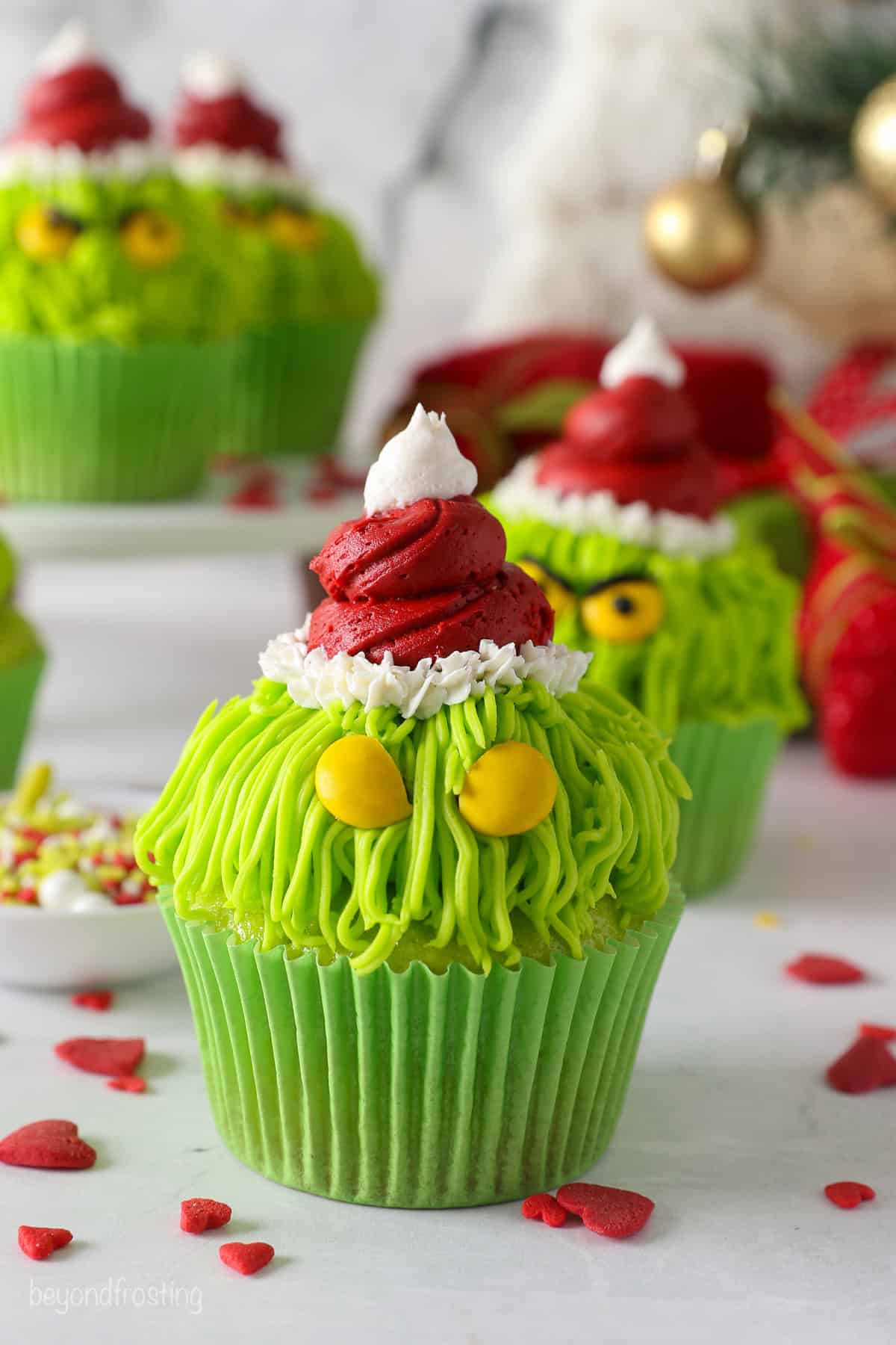 Yellow M&Ms added to a decorated Grinch cupcake, for the eyes.