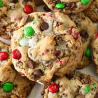 A close up of the top of a Christmas-themed Elf Cookie showing the M&Ms, chocolate chips and pools of melted marshmallows