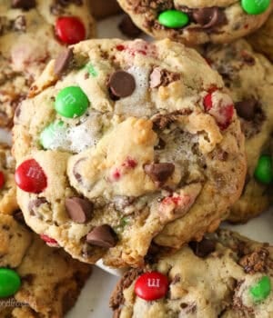 A close up of the top of a Christmas-themed Elf Cookie showing the M&Ms, chocolate chips and pools of melted marshmallows