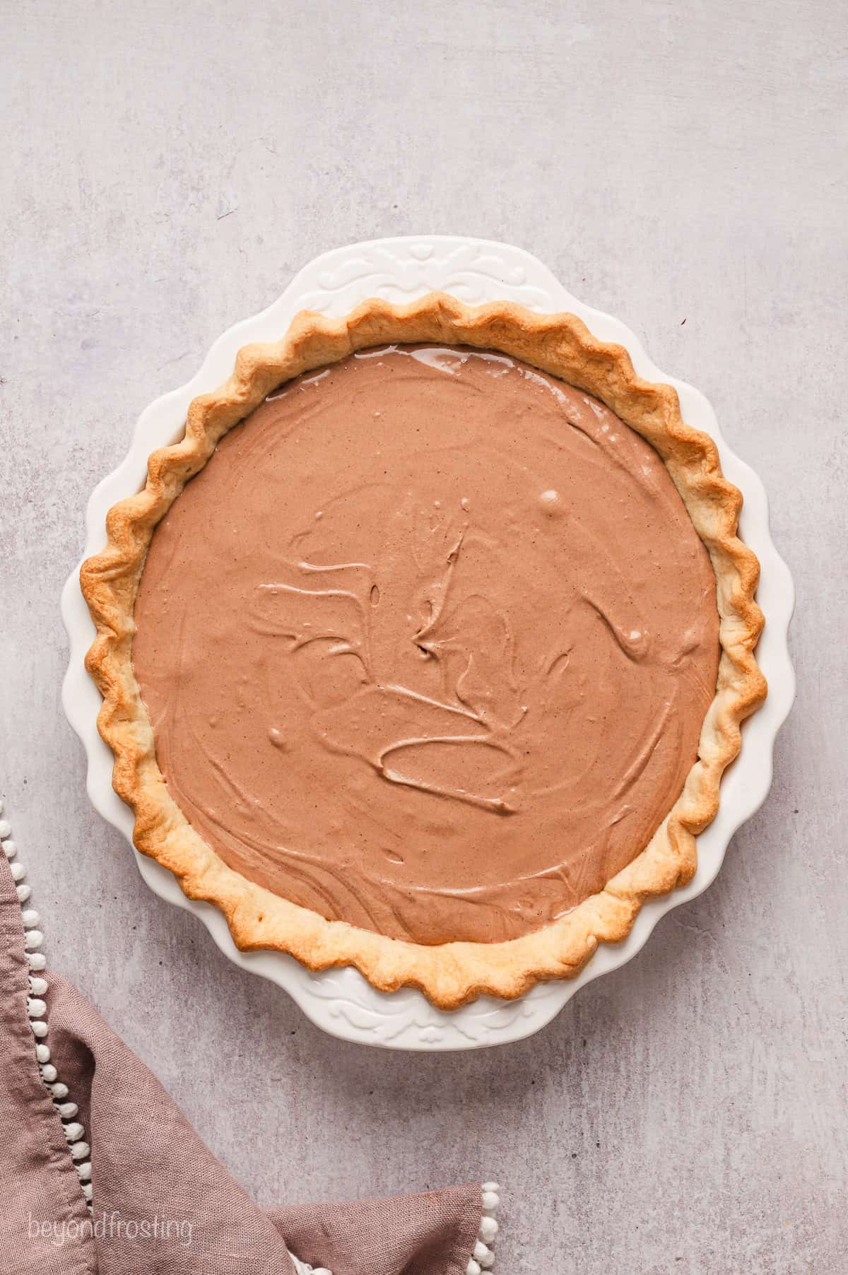 French silk pie filling inside a pie crust.